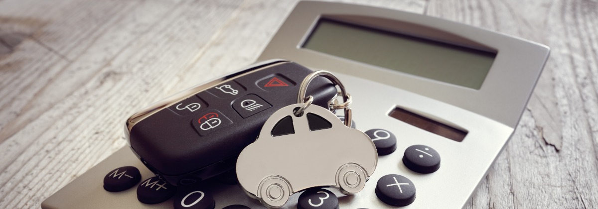 The new budget - image shows calculator with a a car key and keyring on it