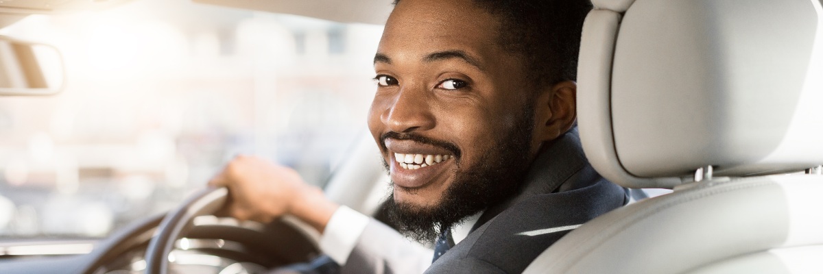 man happy to be on driving lessons
