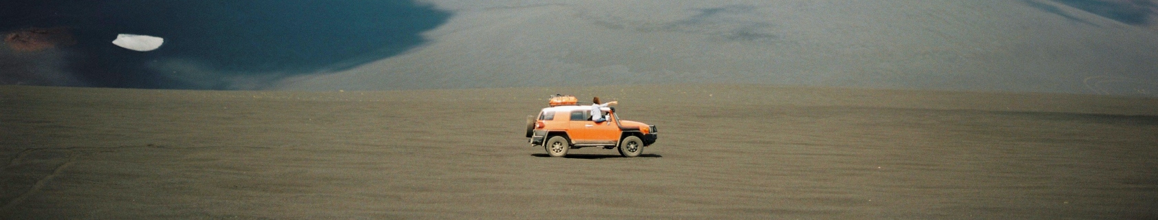 Orange SUV in the desert