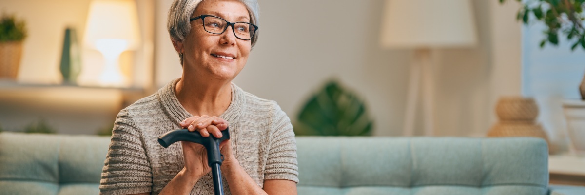 Lady holding walking stick