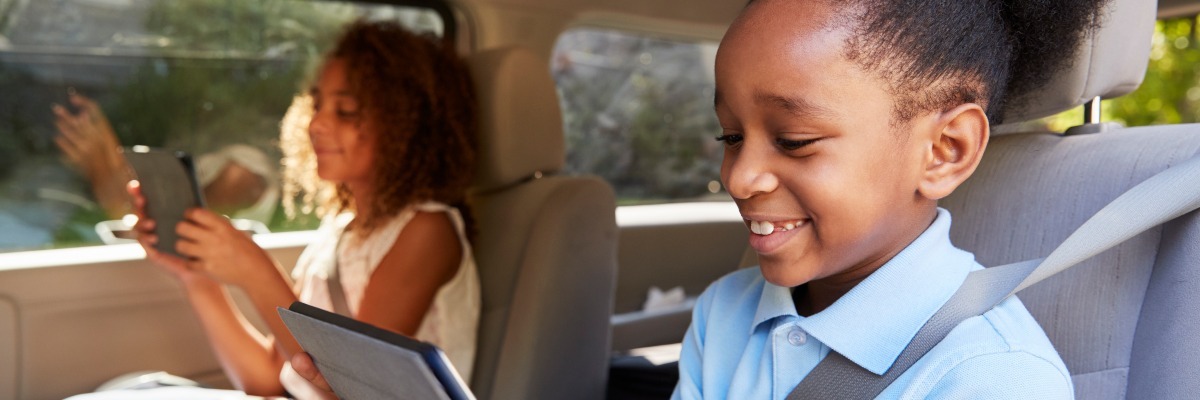 Children in the car on game devices