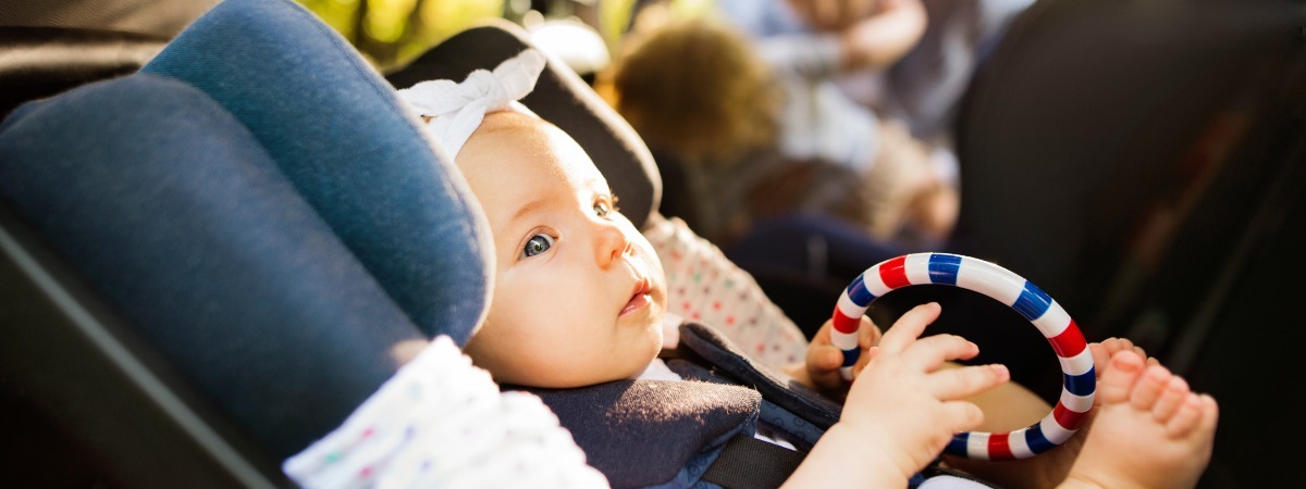 Baby travelling rear-facing in car seat