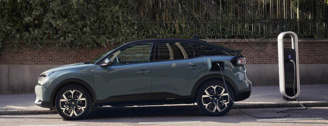 A Citroen e-C4 parked on the street; another car in the Electric Car Grant list.